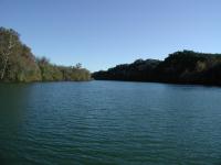 The southern-most tip of Red Bud Isle trail. Downstream is the center of Austin, around the bend.