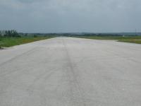 The remnants of the Austin Executive Airport runway facing south.