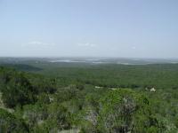 Lake Travis can be seen in the distance, winding its way through the hillcountry.